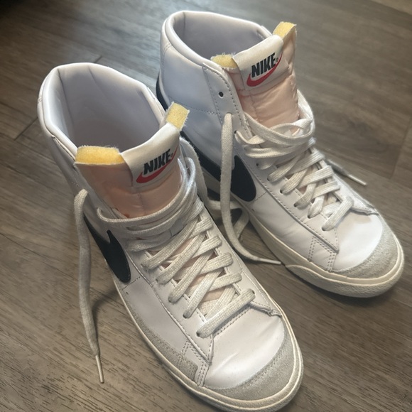 Nike Shoes - Women's Nike Blazers Mid 77' White High-Top Sneakers with Black Swoosh